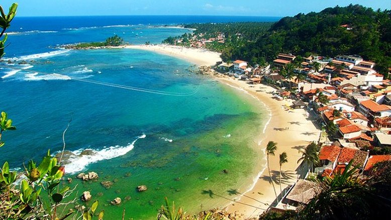 Praia, sombra e água fresca