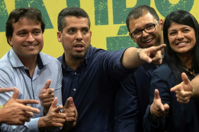 O deputado estadual do Rio de Janeiro Rodrigo Amorim (2º da esquerda para a direita) assiste a uma conferência de Jair Bolsonaro, em 11 de outubro de 2018 no Rio de Janeiro