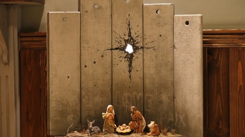 Banksy apresenta em Belém uma obra de Natal sombria