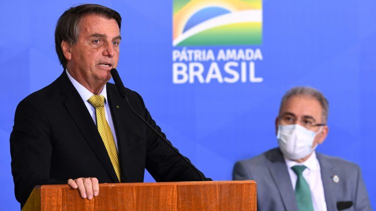 O presidente Jair Bolsonaro ao lado do ministro da Saúde, Marcelo Queiroga, durante evento no Palácio do Planalto, em Brasília, em 29 de junho de 2021 - AFP