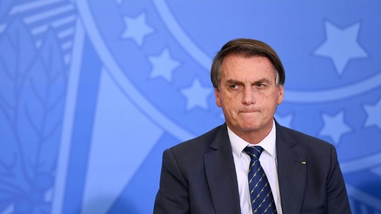 O presidente Jair Bolsonaro durante a cerimônia de lançamento do Cartão Nacional de Identidade no Palácio do Planalto, em Brasília, 23 de fevereiro de 2022 - AFP