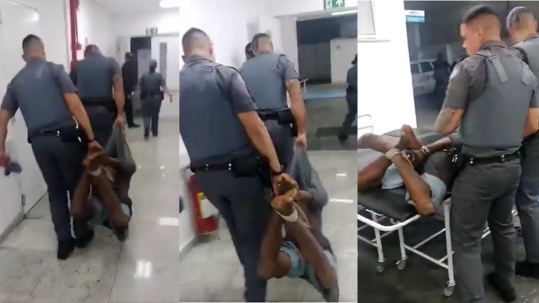 Homem negro amarrado por policiais militares