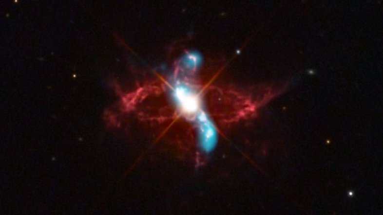 A estrela variável R Aquarii é, na verdade, um sistema estelar binário em interação, com duas estrelas que parecem ter uma relação simbiótica. A cerca de 710 anos-luz de distância, na Constelação de Aquário, ela consiste em uma estrela gigante vermelha fria e uma estrela anã branca quente e densa. Elas estão em órbita mútua, em torno de seu centro de massa comum. A luz visível do sistema binário é dominada pela gigante vermelha, mas o material no envelope estendido da estrela gigante fria é puxado pela gravidade para a superfície da anã branca, menor e mais densa, desencadeando uma explosão termonuclear que lança material para o espaço