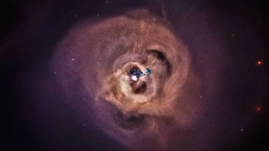 Esta imagem retrata o Aglomerado de Perseu, na qual as cores vermelho, verde e azul mostram raios X de baixa, média e alta energia, respectivamente. O Aglomerado de Perseu é um dos objetos mais massivos do Universo e contém milhares de galáxias imersas numa enorme nuvem de gás superaquecido. Na imagem de raios X, podem ser vistos enormes loops brilhantes, ondulações e listras semelhantes a jatos por todo o aglomerado. Os filamentos azuis escuros no centro são provavelmente devidos a uma galáxia que foi dilacerada e está caindo na NGC 1275 (também conhecida como Perseus A), a galáxia gigante que fica no centro do aglomerado. O Aglomerado de Perseu e NGC 1275 estão a cerca de 250 milhões de anos-luz de distância, na direção da Constelação de Perseu