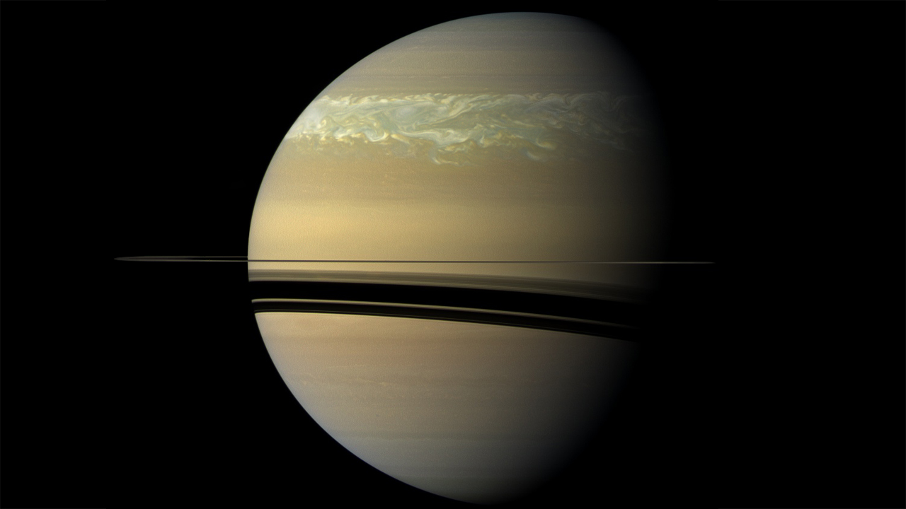 Uma tempestade espetacular, massiva o suficiente para ser vista da Terra, irrompeu no Hemisfério Norte de Saturno, em dezembro de 2010. A tempestade gerou nuvens brilhantes que envolveram todo o planeta, enquanto o seu poderoso vórtice se tornou maior do que a Grande Mancha Vermelha de Júpiter. Seis meses após o início da tempestade, à medida que os sinais visíveis começaram a desaparecer, a sonda Cassini e observadores terrestres registraram Saturno liberando uma energia sem precedentes e uma enorme quantidade de gás etileno. Os cientistas ainda estão intrigados com a misteriosa liberação de etileno, gás que normalmente não é observado em Saturno