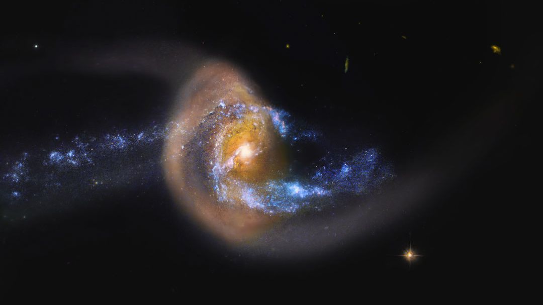 Embora a dinâmica precisa por trás desta imagem ainda não esteja completamente esclarecida, sabe-se que a galáxia retratada, NGC 7714, foi esticada e distorcida por uma colisão recente com uma galáxia vizinha. Acredita-se que o vizinho menor, NGC 7715, situado à esquerda, tenha tomado forma por meio de NGC 7714. O anel dourado é composto por milhões de estrelas mais antigas, semelhantes ao Sol, que estão em movimento junto às estrelas interiores mais azuis. Já o centro brilhante parece passar por uma explosão de formação de novas estrelas. NGC 7714 está localizada a cerca de 130 milhões de anos-luz de distância, na direção da Constelação de Peixes