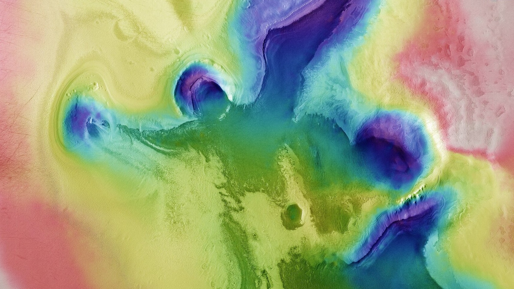 Esta imagem topográfica codificada por cores mostra um par de silhuetas peculiares, que lembram o formato de um anjo e também de um coração, avistadas pela missão Mars Express, da ESA, perto do pólo sul de Marte. Os dados foram colhidos pela espaçonave em novembro de 2020. Esta visão baseia-se num modelo digital do terreno da região, a partir do qual  deriva-se a topografia da paisagem. As partes mais baixas da superfície são mostradas em tons de azul e roxo, enquanto as regiões de maior altitude aparecem em branco e tonalidades de amarelo e vermelho