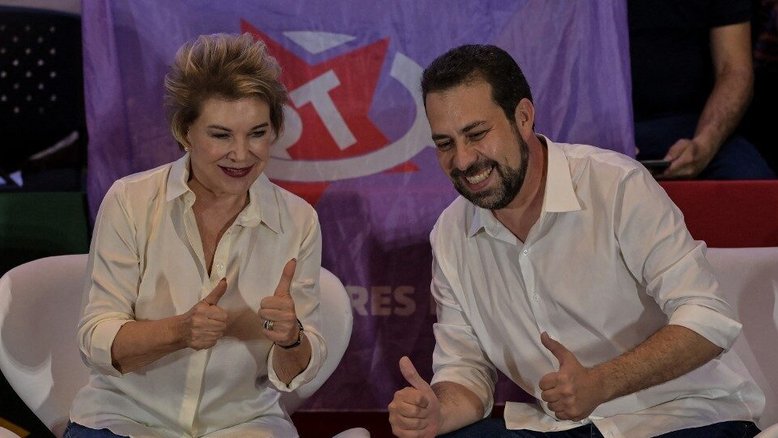 Sao Paulo's congressman and mayoral pre-candidate for the Socialism and Freedom Party (PSOL), Guilherme Boulos (R), attends the former Sao Paulo's mayor Marta Suplicy's (L) affiliation ceremony to the Workers' Party (PT) in Sao Paulo, Brazil, on February 2, 2024. (Photo by Nelson ALMEIDA / AFP)