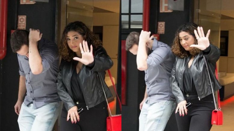 Camila Moura deixa motel com homem