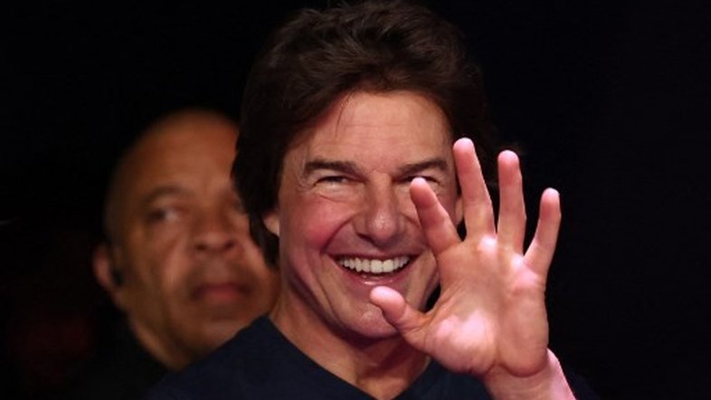US' actor Tom Cruise reacts as he attends the closing ceremony of the Paris 2024 Olympic Games at the Stade de France, in Saint-Denis, in the outskirts of Paris, on August 11, 2024. (Photo by Franck FIFE / AFP)