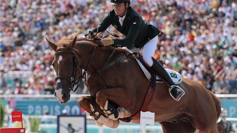 Paris 2024 Olympics - Equestrian - Jumping Team Qualifier - Chateau de Versailles, Versailles, France - August 01, 2024. Pedro Veniss of Brazil riding Nimrod De Muze in action. REUTERS/Zohra Bensemra