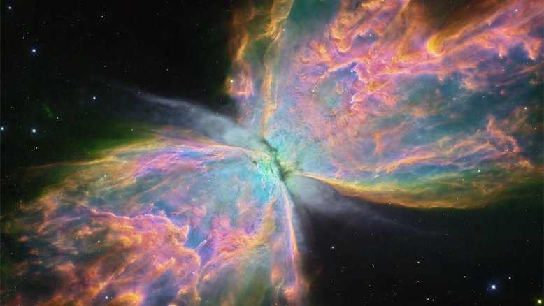 NGC 6302, a Nebulosa da Borboleta, tem uma envergadura gasosa que cobre mais de 3 anos-luz, com uma temperatura superficial estimada que ultrapassa 200 mil graus Celsius. A sua envelhecida estrela central tornou-se excepcionalmente quente, brilhando intensamente na luz visível e ultravioleta, mas escondida para a observação direta pela poeira. Esta imagem, registrada pelo Telescópio Espacial Hubble, foi processada para mostrar detalhes notáveis ​​da complexa nebulosa planetária, destacando em particular a luz emitida pelo oxigênio (azul), hidrogênio (verde) e nitrogênio (vermelho). NGC 6302 fica a cerca de 3,5 mil anos-luz de distância, na Constelação de Escorpião