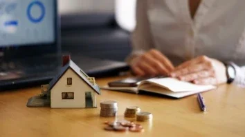 Closeup shot of a person thinking of buying or selling a house
