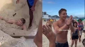 Turista americano aparece preso na areia e depois em pé, em pose de agradecimento