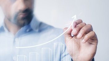 Man giving a business presentation using a high technology digit