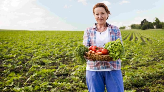 woman-holding-basket-full-vegetables-with-copy-space-2-770x433