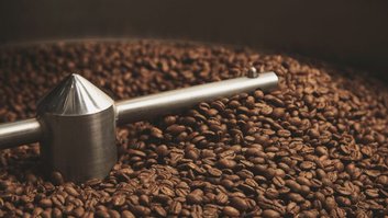 beans freshly baked  hot inside roasting machine closeup