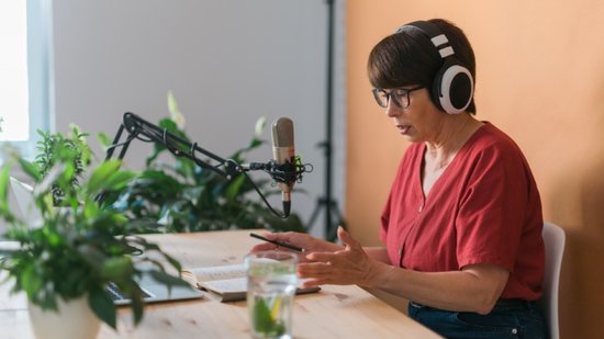 middle-aged-female-radio-presenter-talking-into-th-2025-02-24-19-26-09-utc-1-770x433