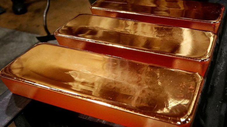 Criptomoedas lastreadas em ouro brilham em meio à oscilação de stablecoins