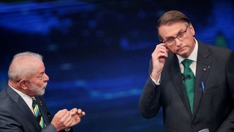 Lula e Bolsonaro durante debate na televisão